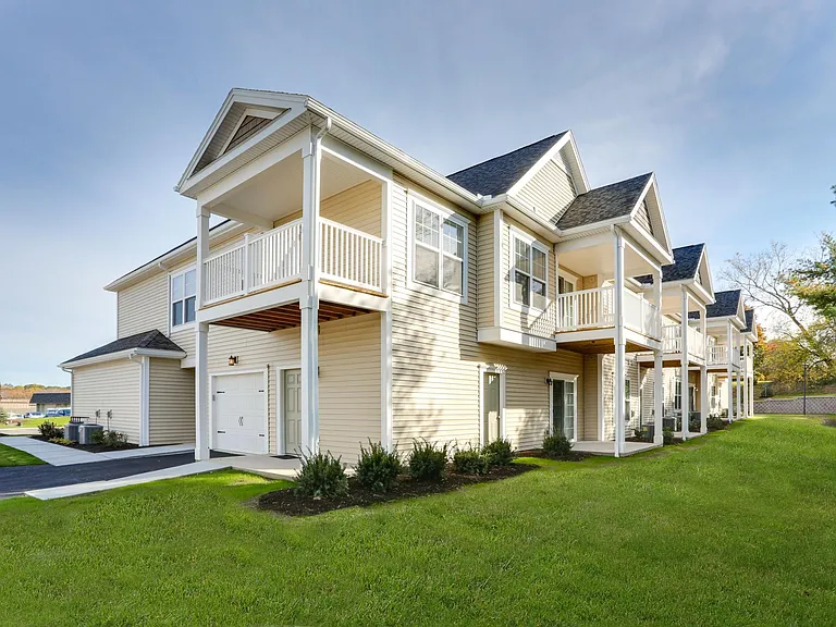 The cozy porches and covered balconies of apartments at The Glen at Perinton Hills in Fairport, NY