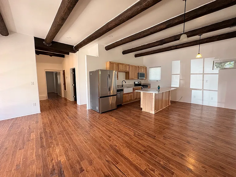 Living room/kitchen with hallway to bedrooms and bath.