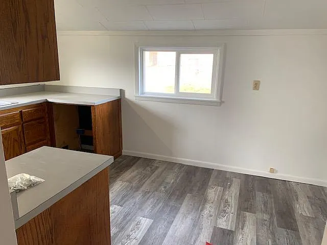 Kitchen back wall; Refrigerator sits to the right