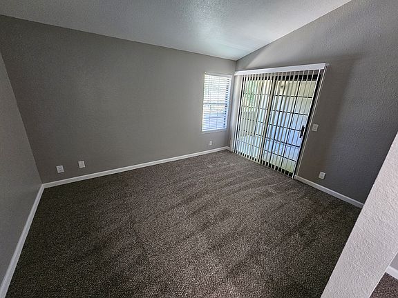 Master bedroom with slider out to the back patio (*2 patios).