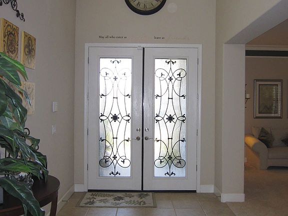 Entry w/Custom Decorative Front Door w/Iron Art Glass