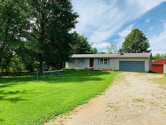 Modest ranch home with barn