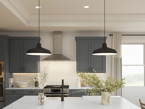 Kitchen with tray ceiling and crown moulding