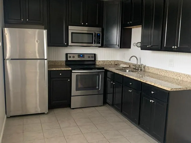 Kitchen
42" dark wood cabinets, stainless steel applicances and granite counters.