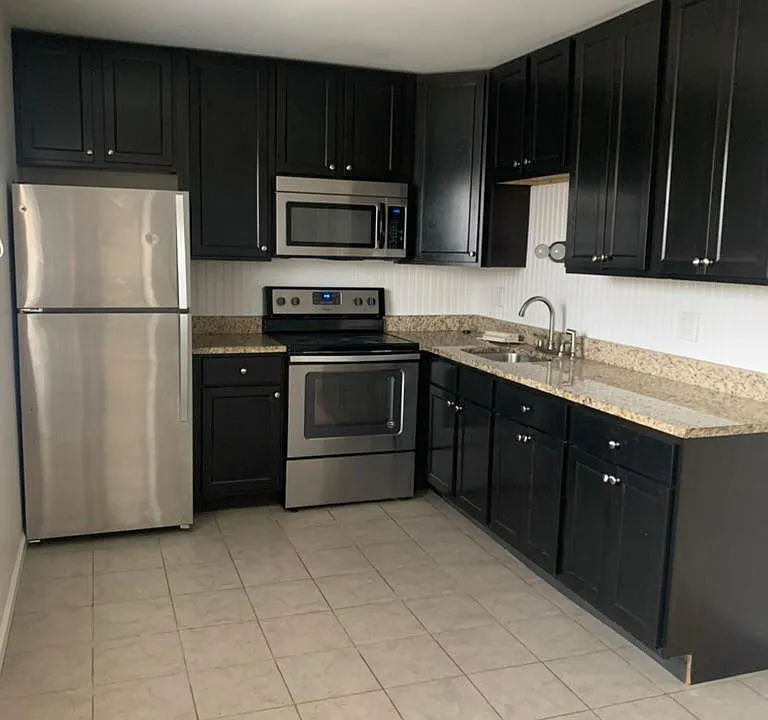 Kitchen
42" dark wood cabinets, stainless steel applicances and granite counters.