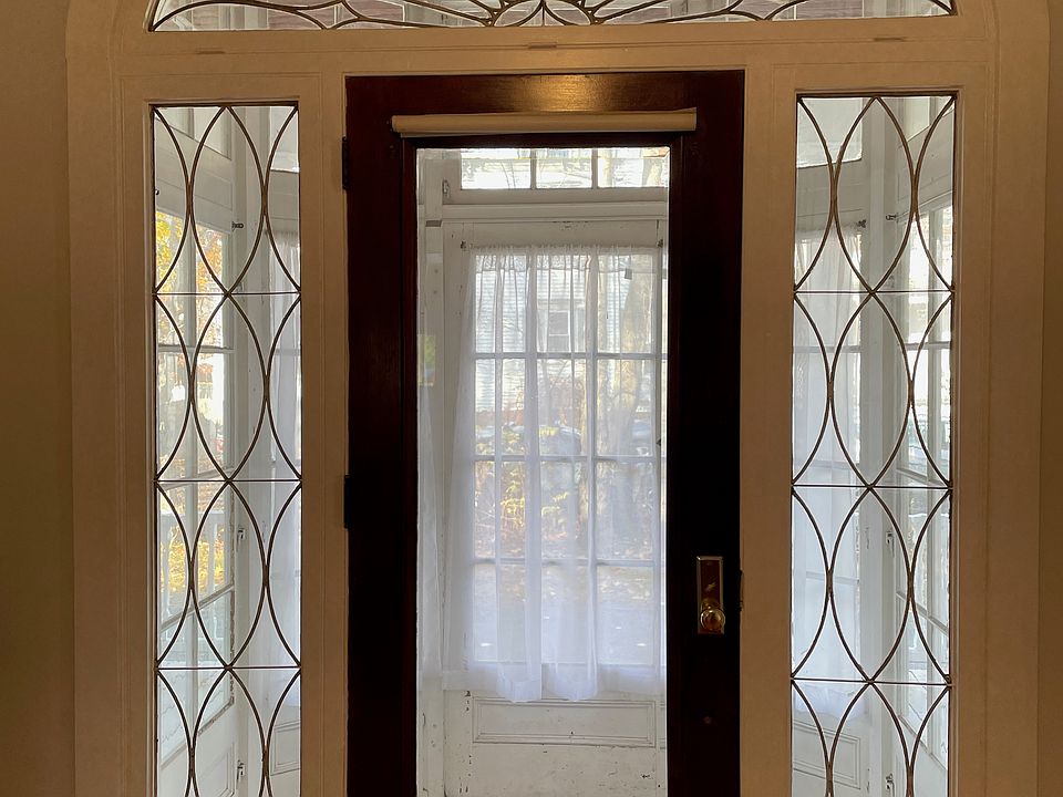 Door to porch with antique leaded glass.