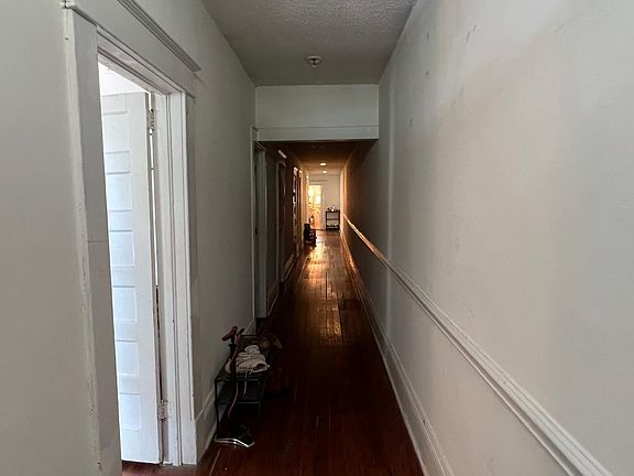 Immediately inside the front door.