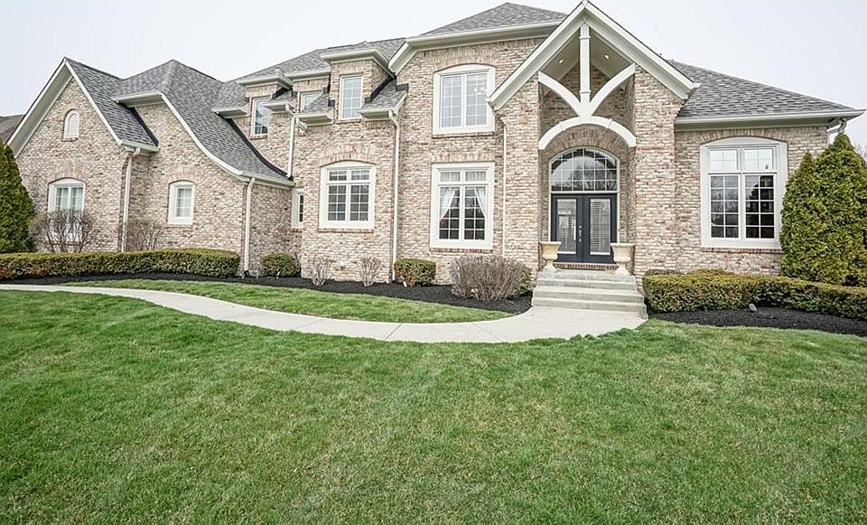 Prestigious All Brick Home! 4 Car side-load Garage.