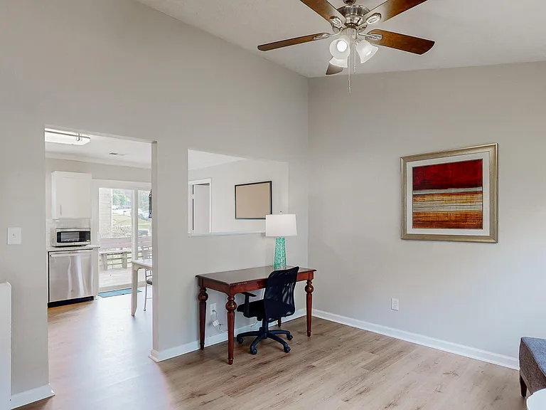 Common area living space with desk.