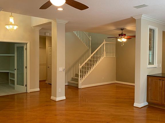 Main living space with office on the left and dining room in the center of the photo