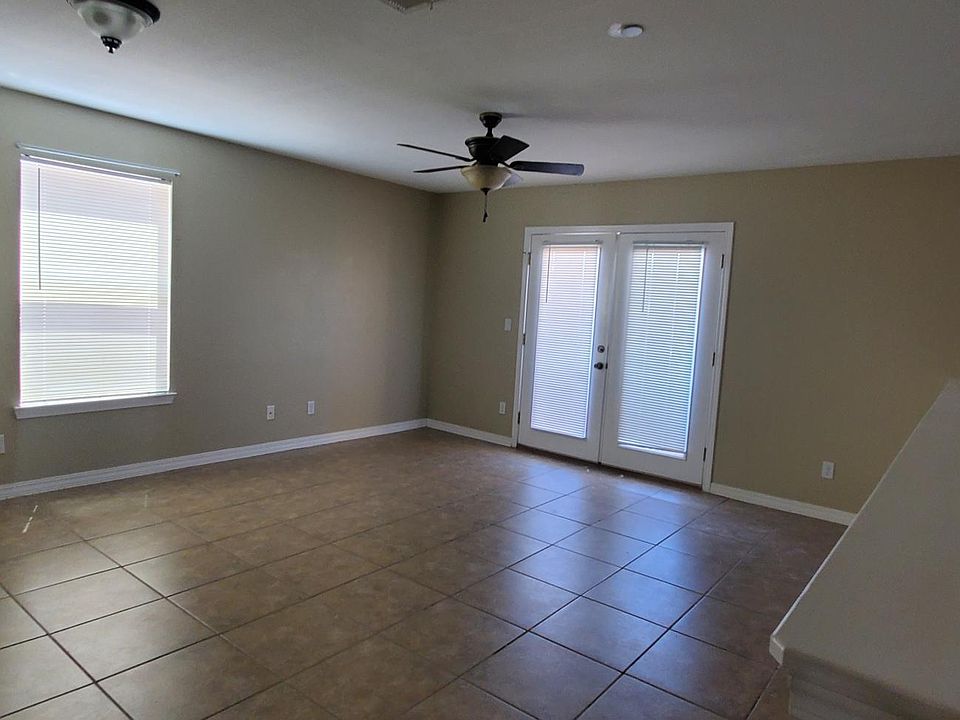 Living area with French doors opening up to Balcony