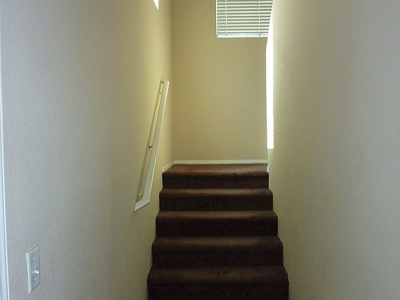 Stairway to living area from attached garage