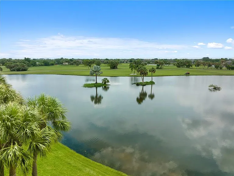 Enjoy STUNNING lake & golf course views from the living room & bedroom!