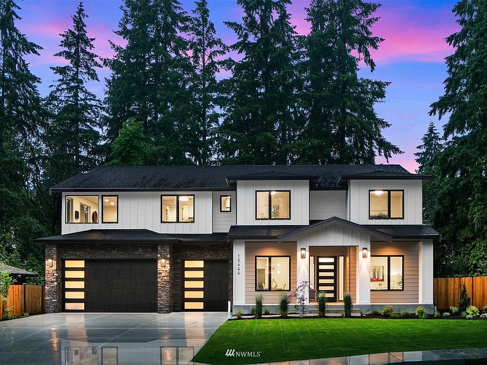 Northwest Contemporary design with extensive stonework, black casement windows, and oversized driveway to provide ample guest parking!