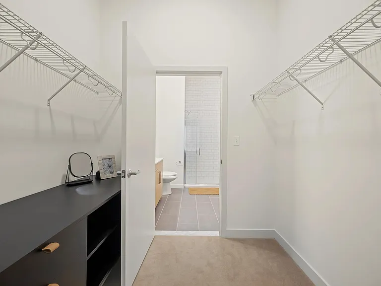 Custom closets with built-in storage and shelving available in select apartments.