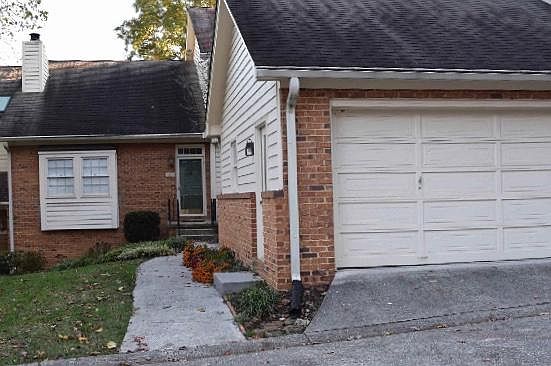 View of Condo Front Door & 2-Car Garage
