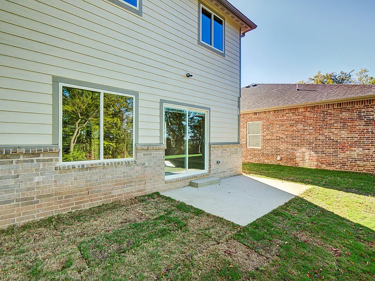 Backyard. It is currently fenced in separately for both units. (Not shown)