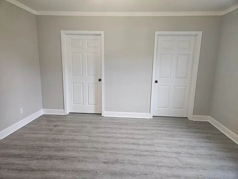 Primary bedroom looking toward closet and bathroom
