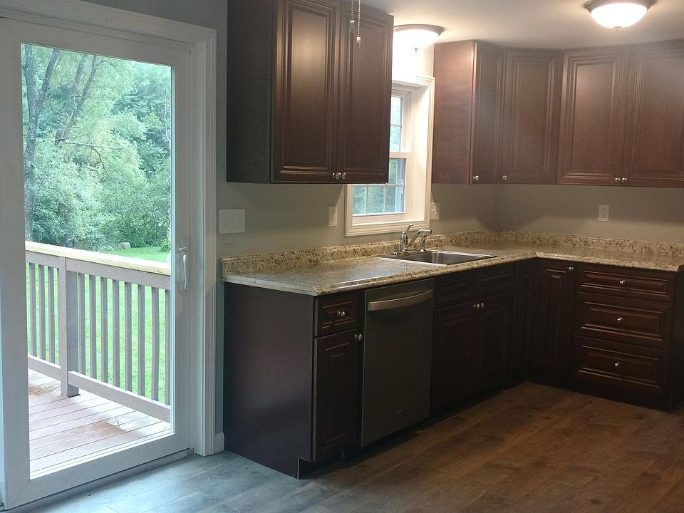 Renovated kitchen with view of backyard and pond