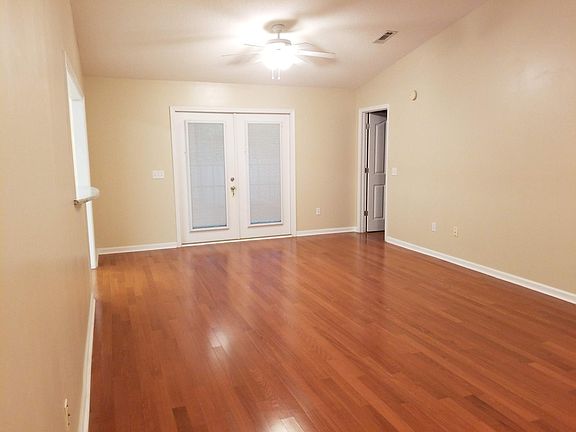 French Doors lead to backyard and the right door leads to the master bedroom