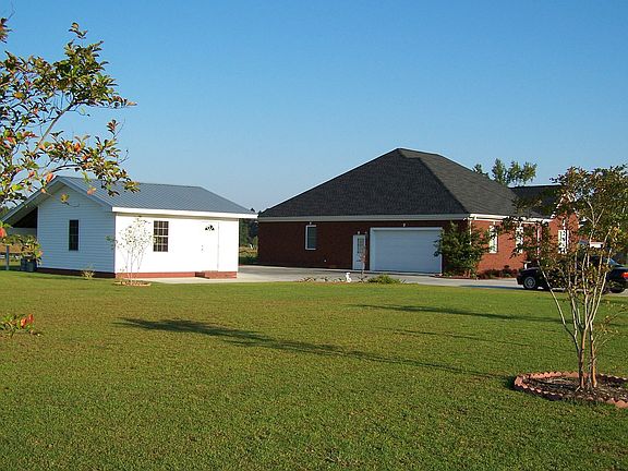 Side view of property showing detached garage