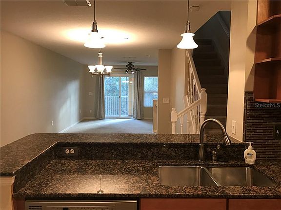 Kitchen looking into dining room and living room.