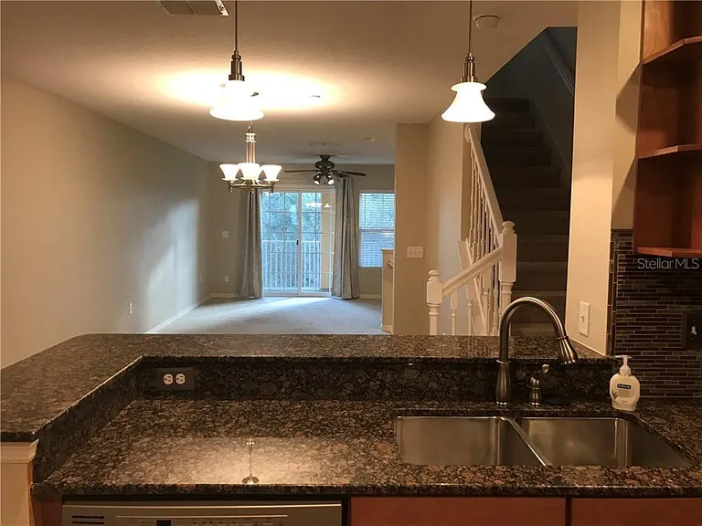 Kitchen looking into dining room and living room.