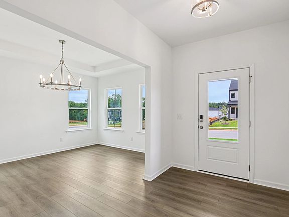 Foyer featuring the AW Collection R Roosevelt - A grand entry with rich tones and presence.