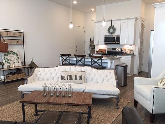 Grandiose 11 foot ceilings soar to elegant recessed lighting.