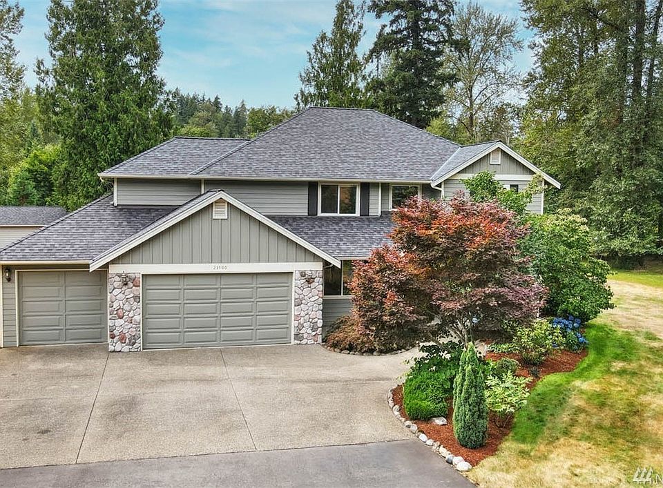 Drive up to this beautiful home in the Woods!  The Cedar River is to the right.
