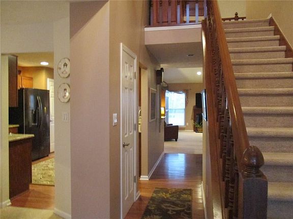 Entry Hall with Hardwood Floors through Kitchen, Back Entry and Breakfast Area