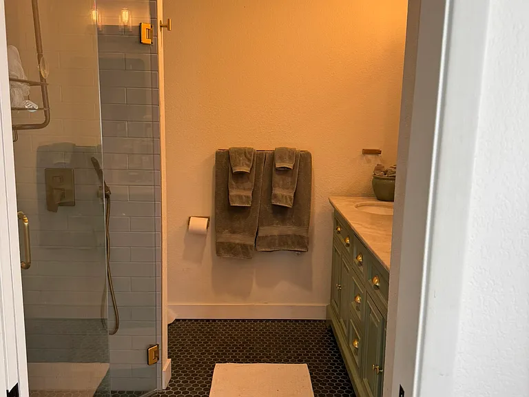 Master bathroom with lovely marble countertop and Toto toilet. Matte gold faucets.