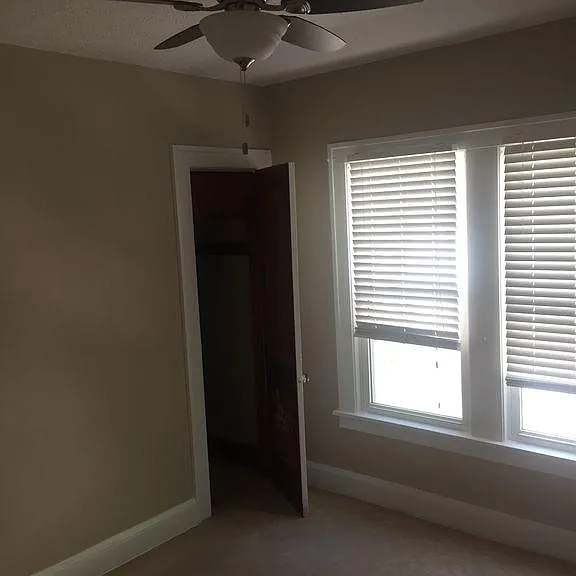 Bedroom with Carpet and walk-in closet plus ceiling fan