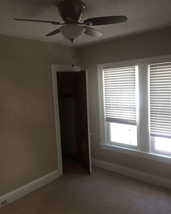 Bedroom with Carpet and walk-in closet plus ceiling fan
