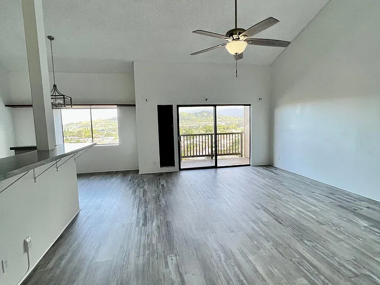 View from the main living space in the unit are mountains across Kaneohe town and trees from the bedrooms