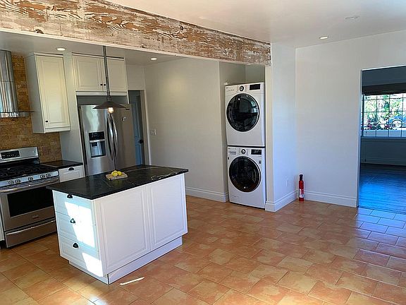 Kitchen with laundry machines