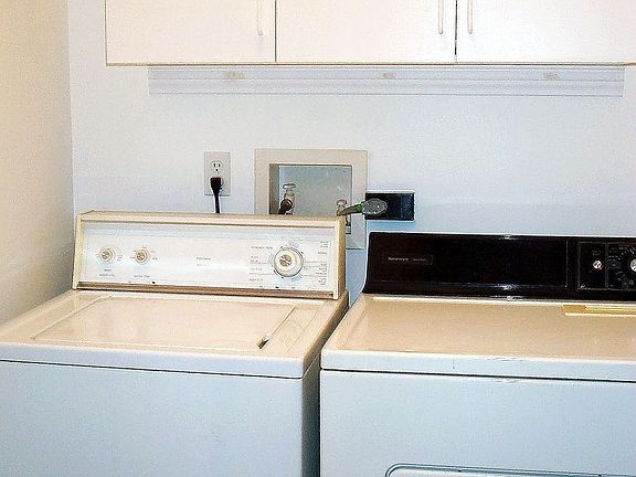Seperate Laundry Room w Cabinets