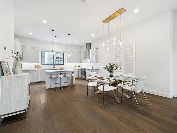 Open concept 2nd floor with large dining hall kitchen. All floors are made from engineered hardwood