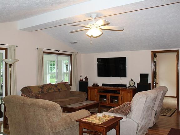 Comfortable great room with laminate floor covering