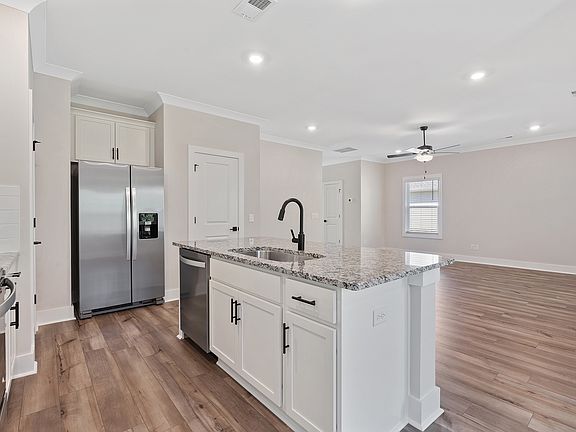 The open layout has the kitchen being open to the family room.