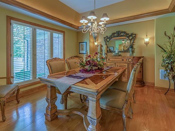 FORMAL DINING IS OFF THE DEN...NOTICE THE LIGHTED TRAY CEILING