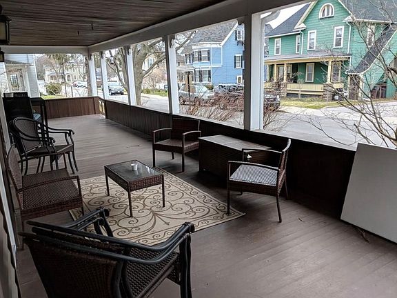Large porch is shared with the other unit in the house, a privacy screen is provided that can be pulled out splitting it into 2 private spaces.
