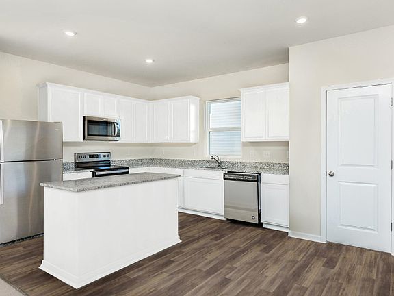 Package A Kitchen with beautiful white cabinets and granite countertops