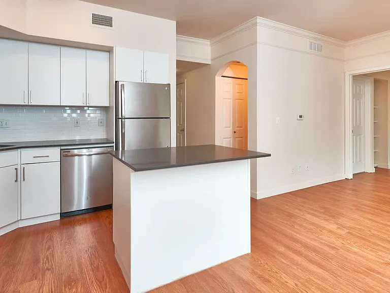 Kitchen with Stainless Steel Appliances and Dining Room