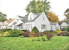 House, lawn, and plantings in good shape