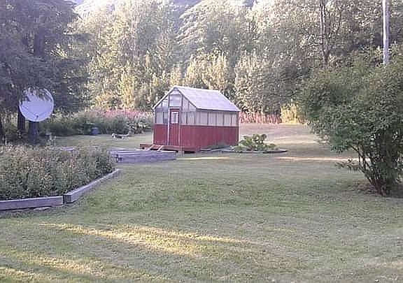 Front yard, greenhouse and garden