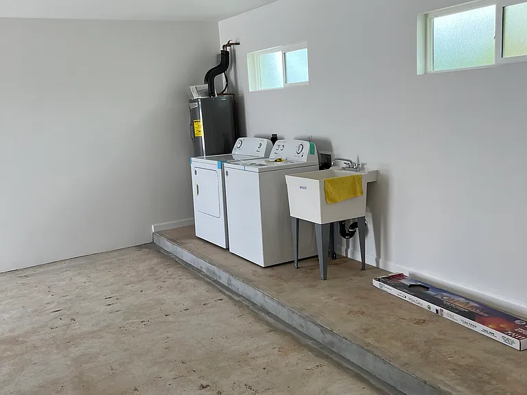 Spacious two car garage with own laundry facilities