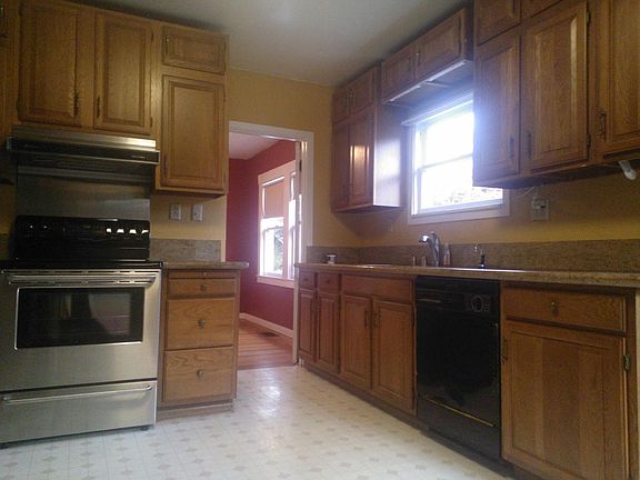 Kitchen with stainless appliances and granite counters