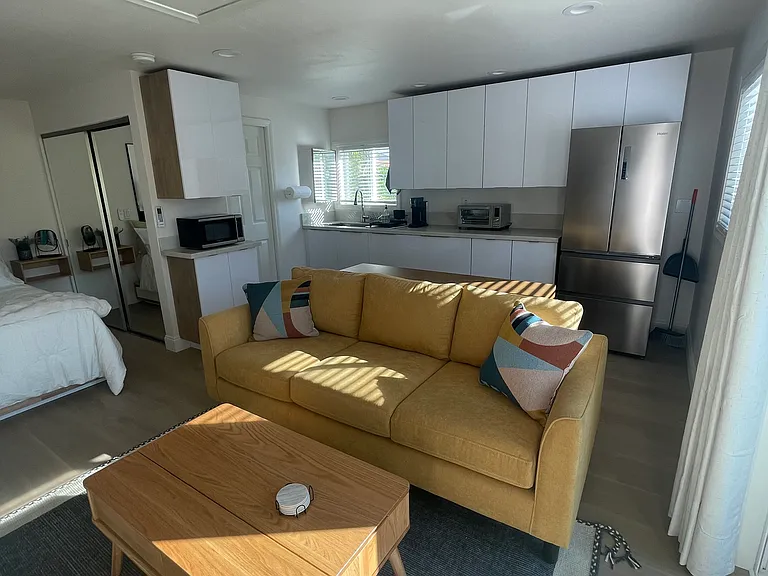 Studio couch with lift top coffee table to use as work station.