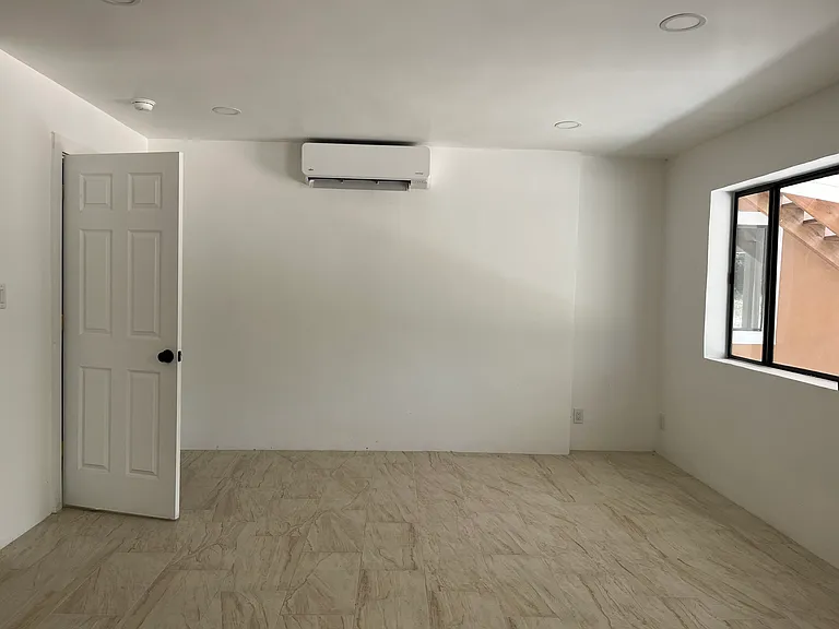 Living Room showing mini splits for air conditioning and heating